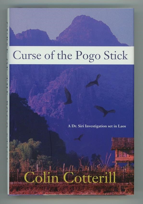 Curse of the Pogo Stick by Colin Cotterill 1st- High Grade
