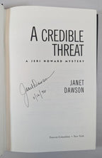 A Credible Threat: A Jeri Howard Mystery by Janet Dawson Signed